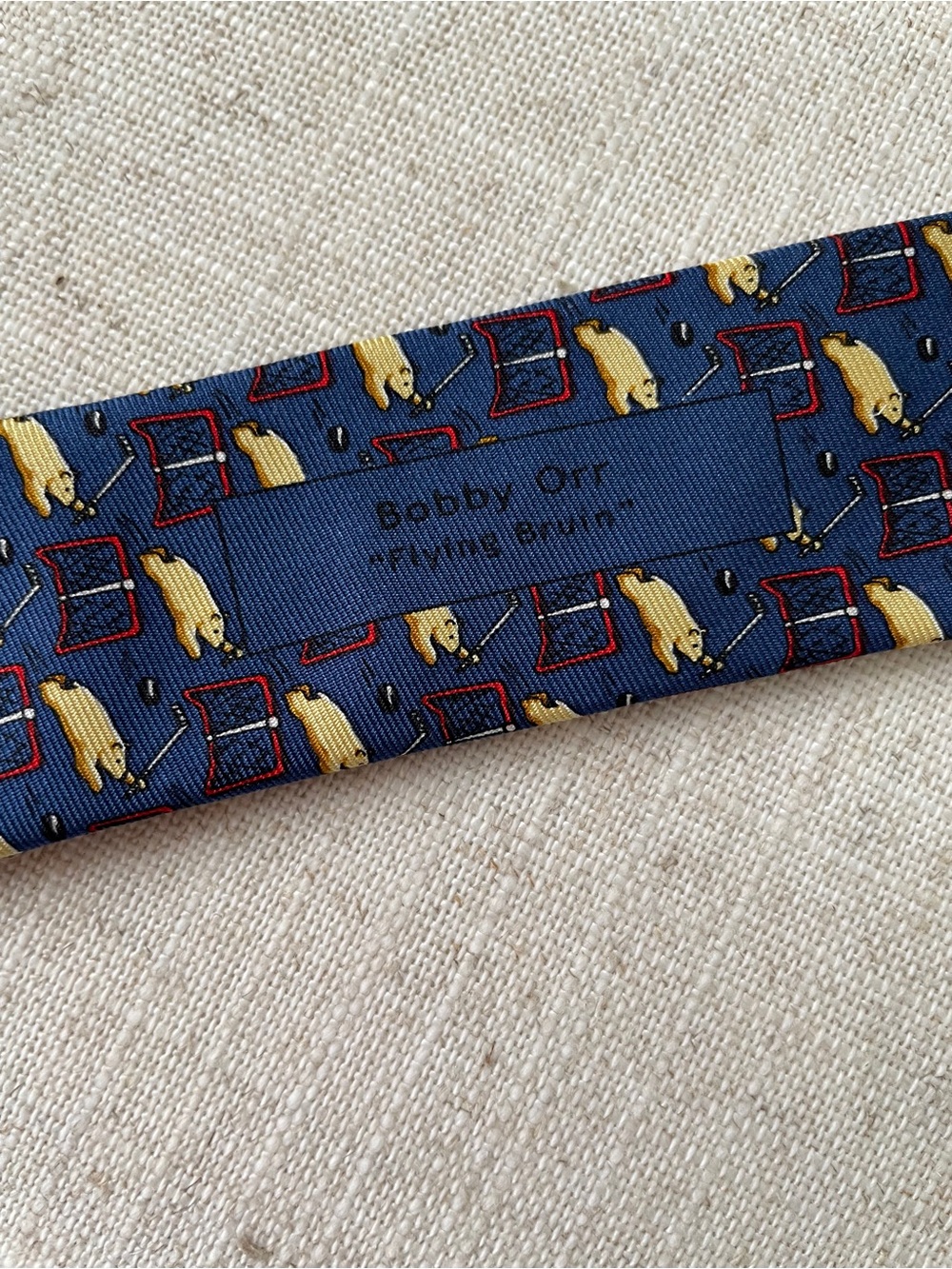 Men's “Flying Bruin” Patterned Silk Tie in Blue/Yellow Motif - Picture 3 of 4